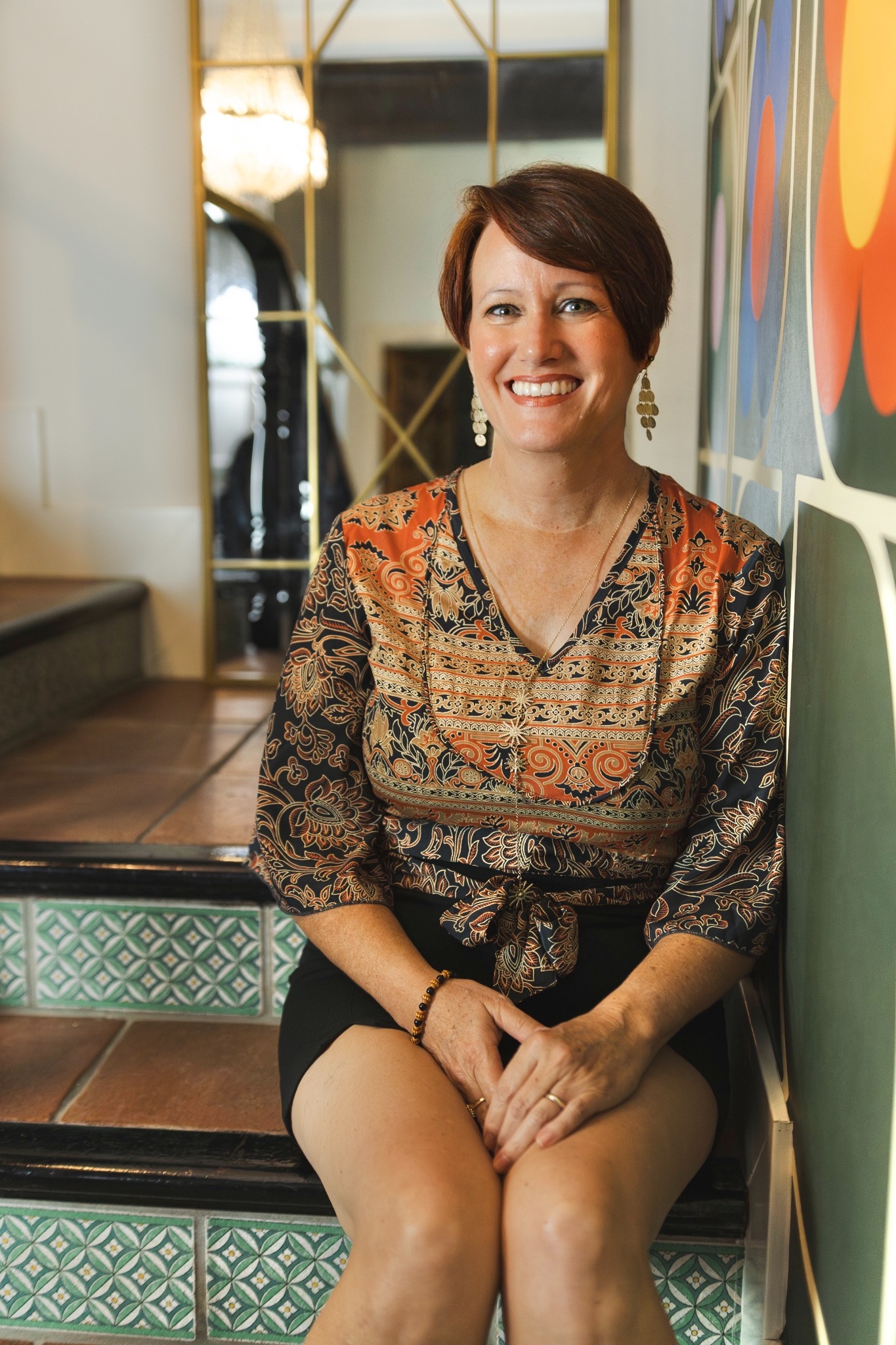 Adrienne seated and smiling